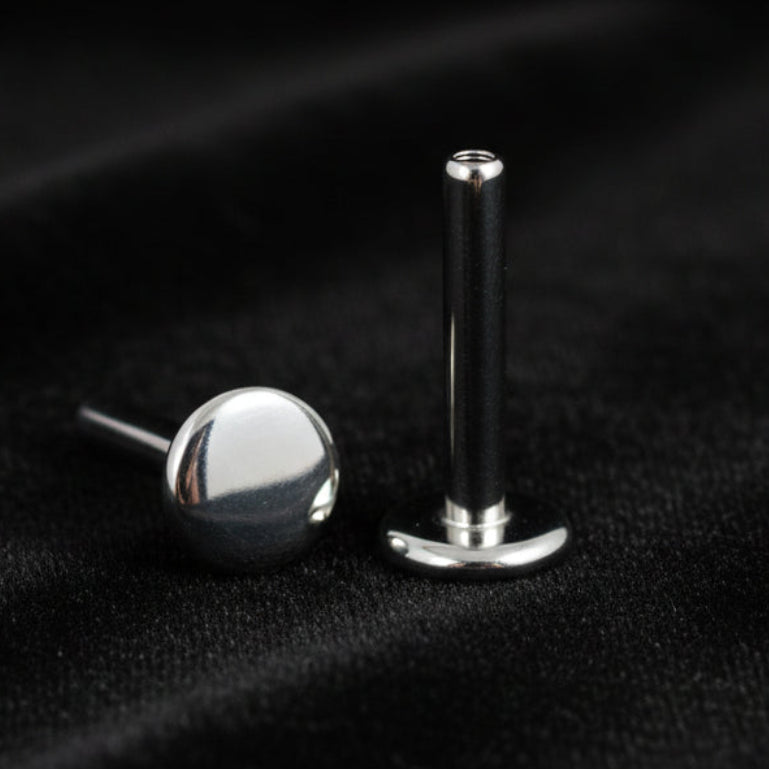 Two metallic objects on a white background