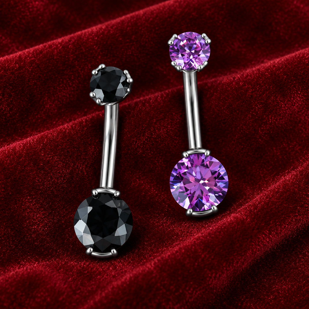 Two silver-toned barbell NAVELpiercings with faceted gemstones, one featuring a large black round stone and a smaller purple round stone, and the other featuring a purple round stone and a smaller black round stone.