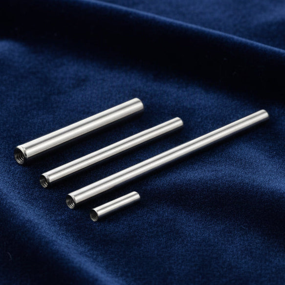 Set of metallic cylindrical bars on a white background
