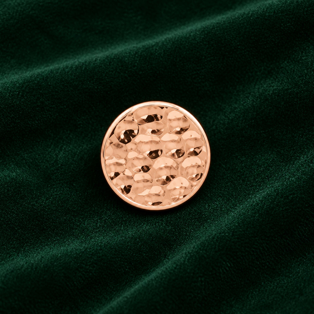 Three small round stud earrings with a textured rose gold finish, displayed on a clean white background with a coin partially visible in the top right for scale.