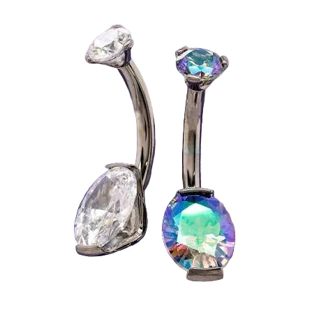 Two silver-toned curved barbell belly button piercings displayed on a purple crystal cluster. One features a clear marquise-cut gemstone, and the other features an iridescent, rainbow-reflecting oval-cut gemstone.