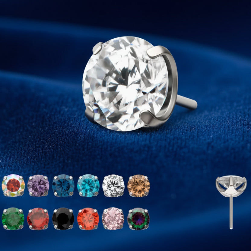 Single stud earring with large clear gemstone and additional gemstones in various colors on a white background.