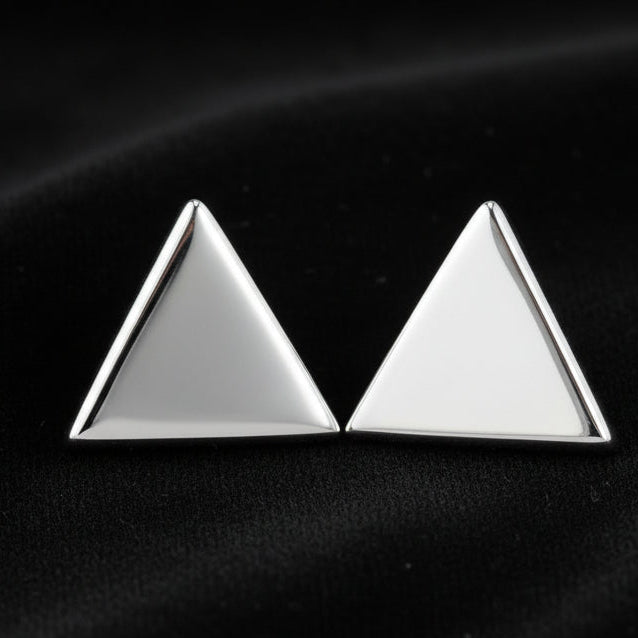 Pair of silver triangle earrings on a white background