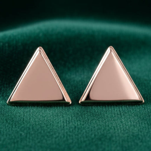 Pair of rose gold triangle earrings on a white background